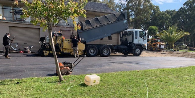 This is a photo of an asphalt driveway which is in the process of being installed by Victor Harbour Road Tech SA